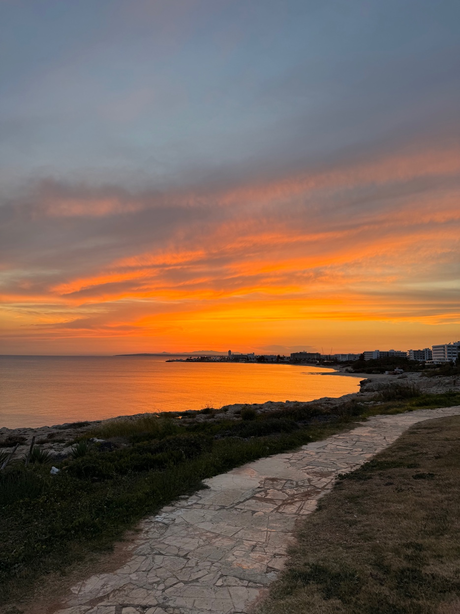 Dramatic orange sunset Ayia Napa bay