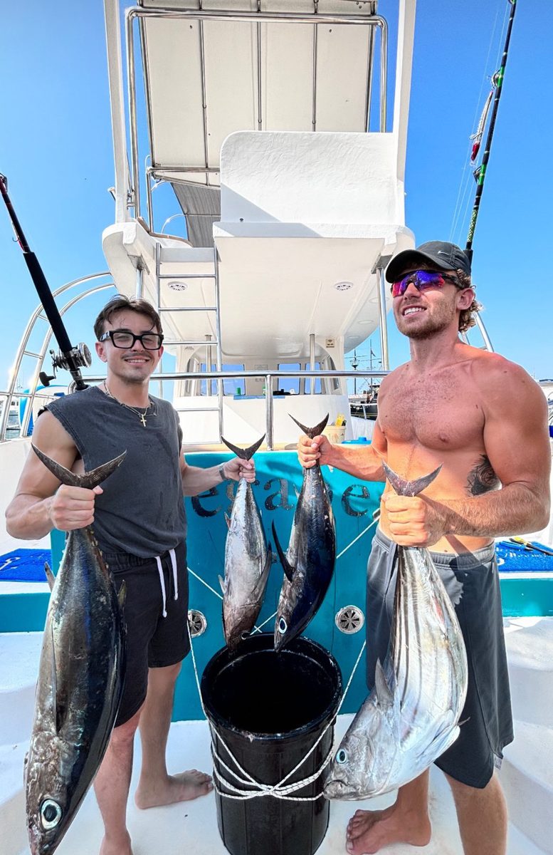 Two guys holding tuna from Ayia Napa fishing trip