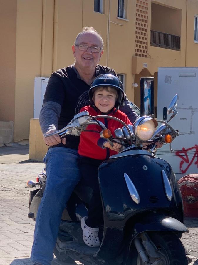 Andreas Kyriakoudes with grandchild on scooter Ayia Napa